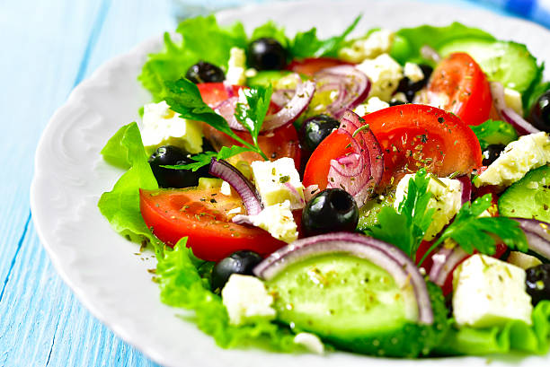 istock Traditional greek salad on a white plate. 537340656