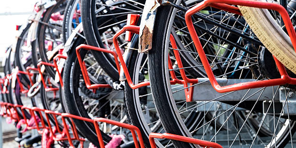 istock Bicycles in bicycle parking rack at train station in Holland 537343950