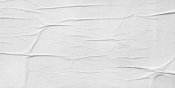 Photo of Wrinkled paper glued on wall texture