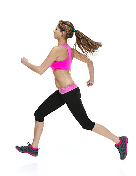 istock Attractive female in exercise clothing & running 537346201