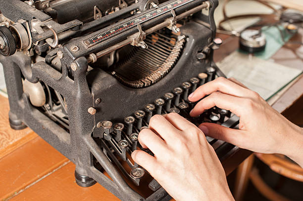istock Male Typist on an Antique Typewriter. 537346447