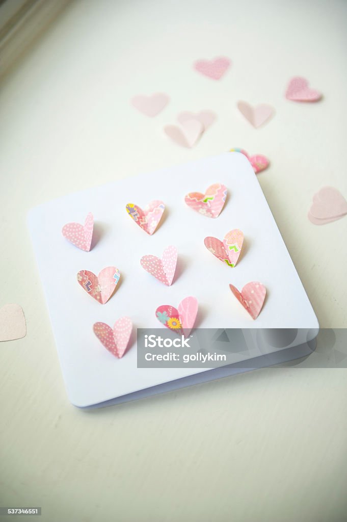 Valentine's Card with heart shape paper cutout (handmade by me) Close up of a Handmade Card with pop-up heart Shaped (Shallow Depth of field) 2015 Stock Photo