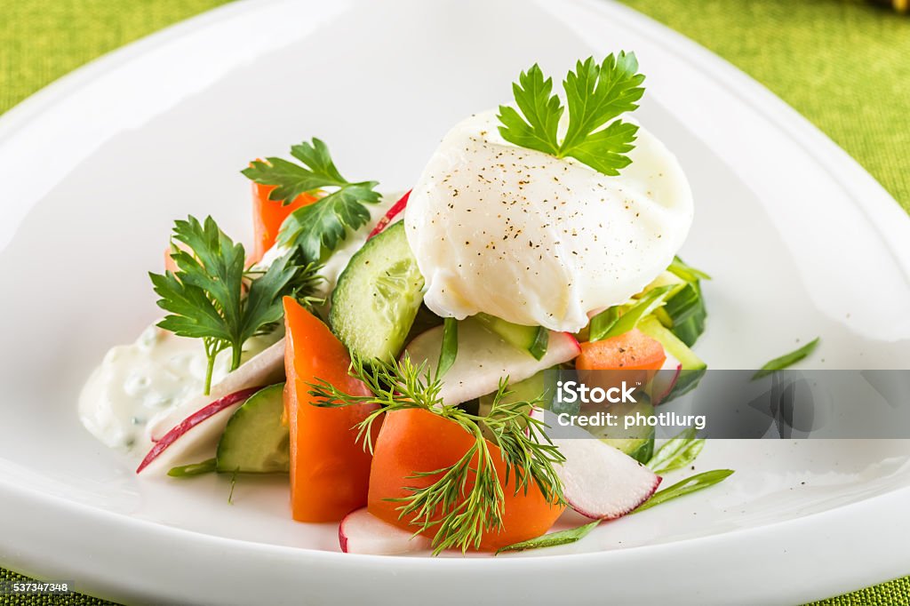 Fresh vegetables salad Fresh mixed vegetables salad on white plate Appetizer Stock Photo