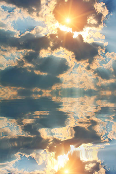 istock Beautiful reflection of clouds and sun in water 537347603