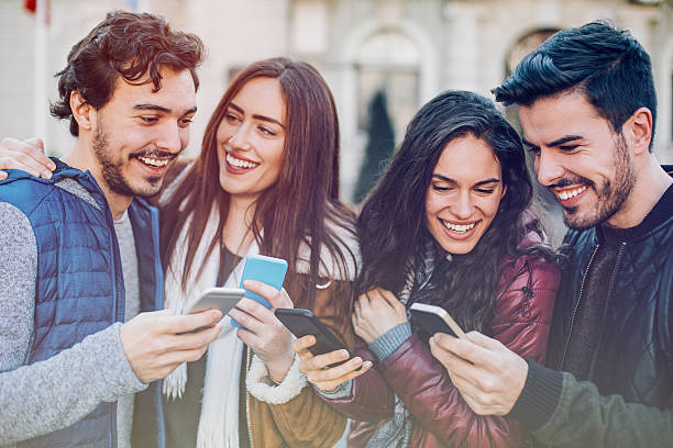 istock Group of young people with smart phones 537348356