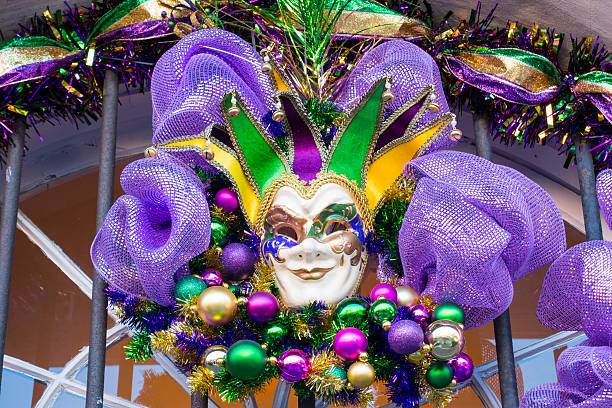 Mardi Gras Mask in New Orleans Mardi Gras mask decor on a door in New Orleans, Louisiana. new orleans mardi gras stock pictures, royalty-free photos & images