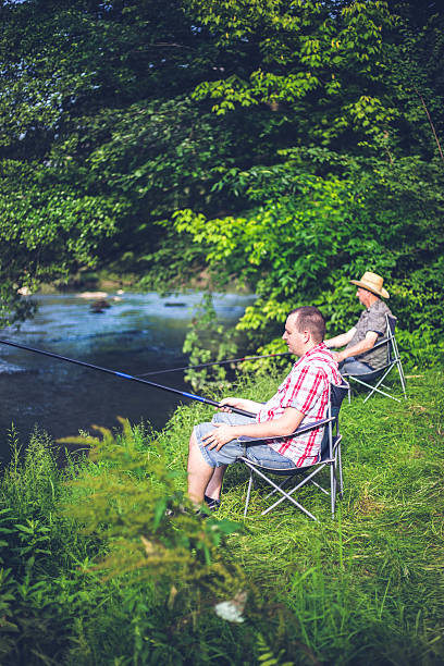 istock people fishing on the river 537348424