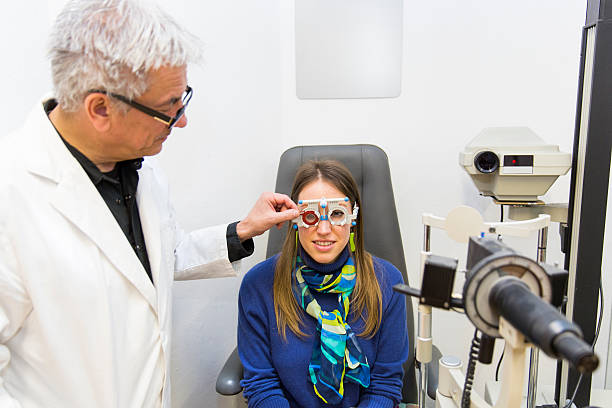 istock Young woman at the optometrist,doctor is checking her vision 537348974
