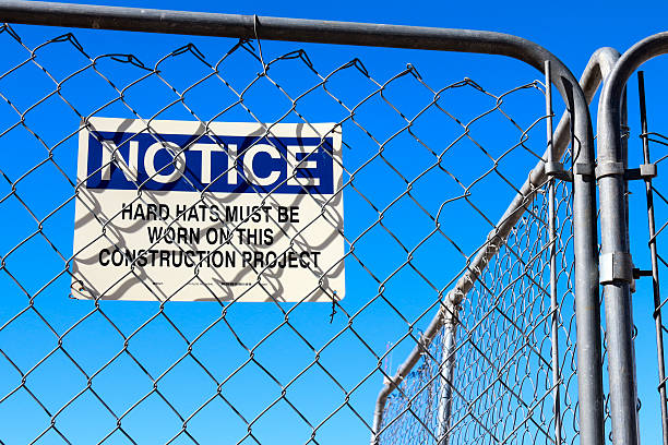 istock White notice sign that Hard hats must be worn 537349611