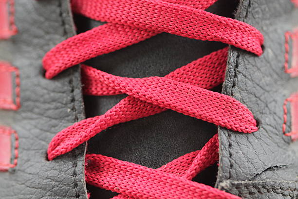 Red laces and red shoes.