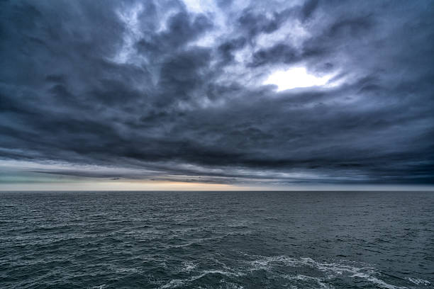 istock Dark stormy cloud above the sea, dark tone nature abstract 537350720