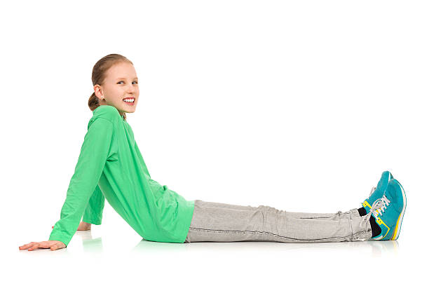 istock Smiling Child Girl Sitting On Floor 537351600