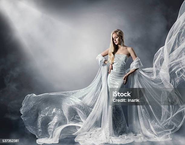Young Woman Fashion Shiny Dress Lady Flying Clothes Star Light Stock Photo - Download Image Now