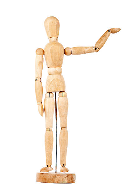 istock Wooden dummy with raised hand 537353966