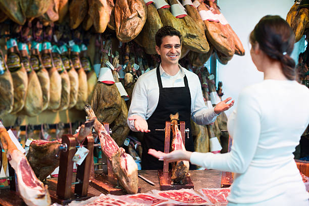 istock Female customer buying Spanish jamon 537356064