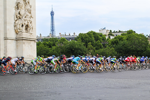 Paris, France – July 27, 2014:  Tour de France. Bicycle peloton on the Final circle. Champs Elysees. Sport competitions.