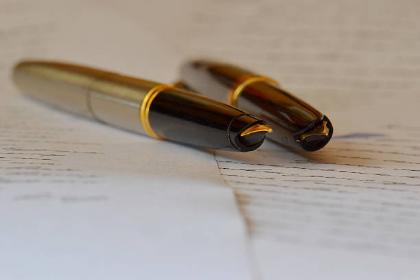 istock pens on a handwritten letter 537356956
