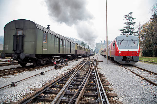 istock Old steam train and new electric train 537357780