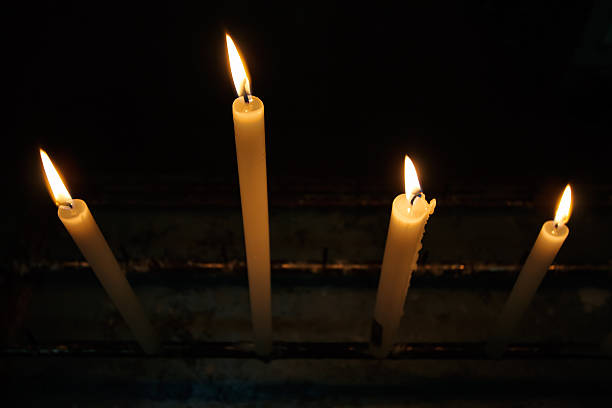 Candles on candle holder at church