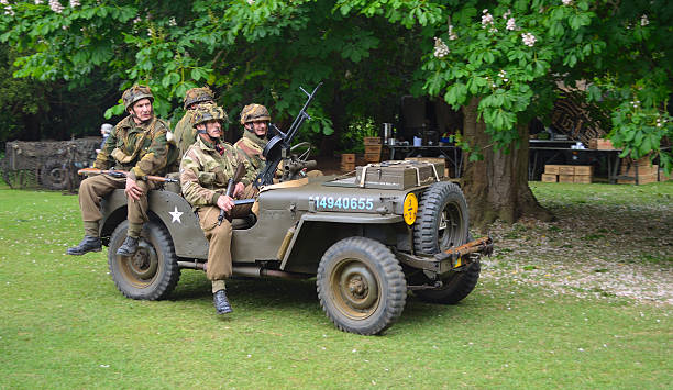 Silsoe, Bedfordshire, England - May 30, 2016: World War 2 Jeep with men dressed as World War 2 American Soldiers.