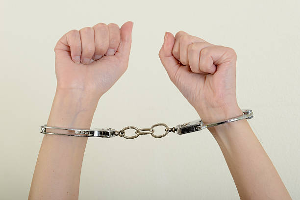 istock Hands of a woman with handcuffs 537358778