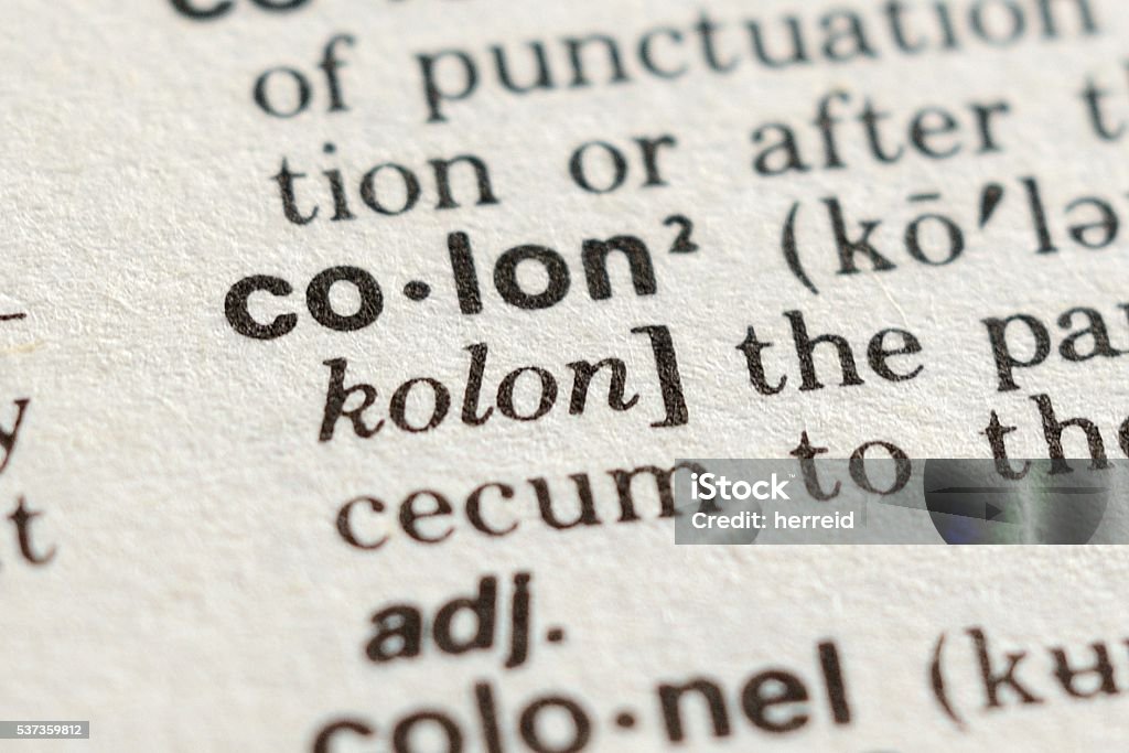 The Word Colon Close-up of The Word Colon in a Dictionary Black Color Stock Photo