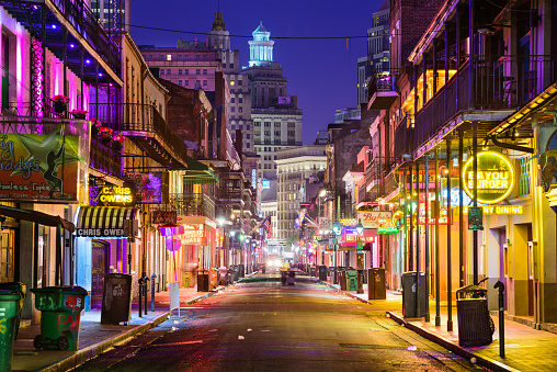 New Orleans, LA, USA - May 10, 2016: Neon bar signs line Bourbon Street in the early morning. The renown nightlife destination is in the heart of the French Quarter.