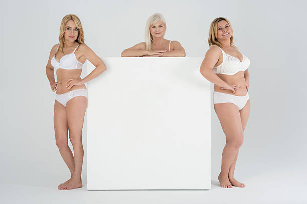 istock Women in variety shape of body with empty billboard 537363312