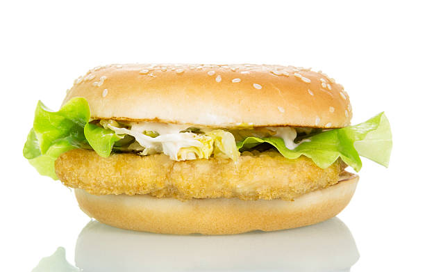 istock Chicken burger with lettuce and cabbage isolated on white. 537363640