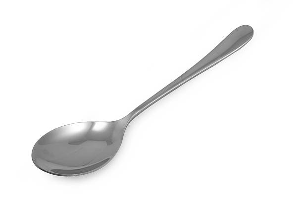 istock Stainless steel glossy metal kitchen spoon isolated 537364480