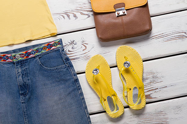 istock Yellow flip flops and skirt. 537365558