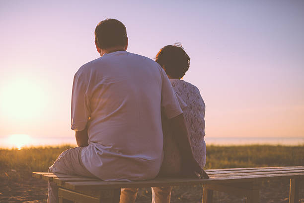 istock Senior couple enjoy the sunset together 537365873