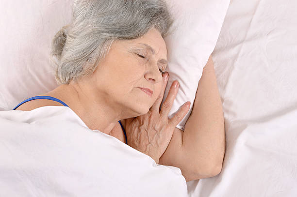 istock older woman sleeping in the bedroom 537366282