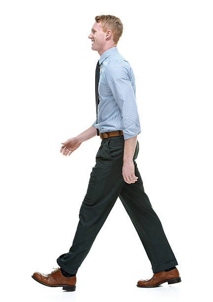 istock Smiling businessman walking & looking away 537366543