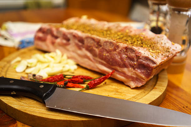 Fresh pork ribs, meat marinated and prepared for roast