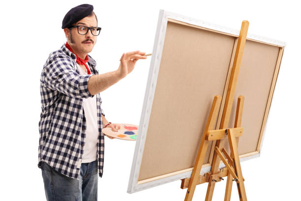 istock Young focused artist painting on a canvas 537368198