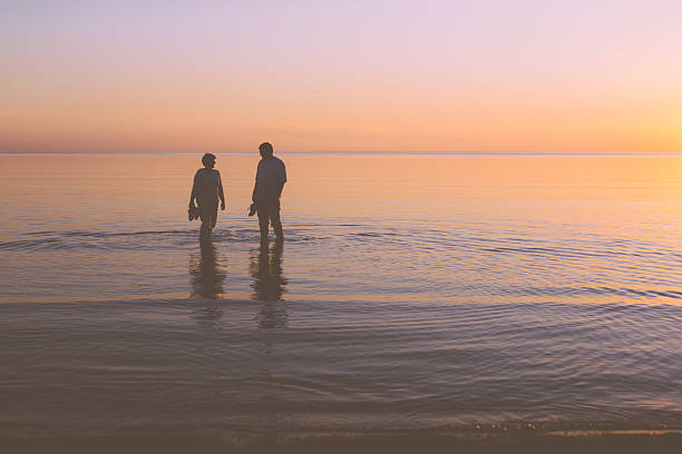 istock Senior couple strolling at sunset 537368275