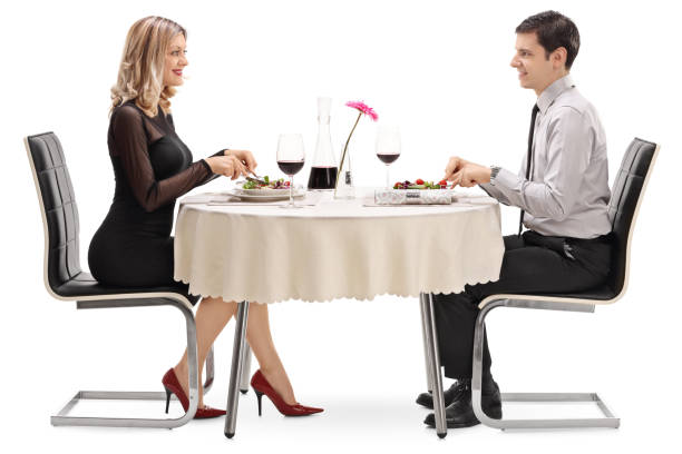 istock Young man and woman eating on a date 537368464