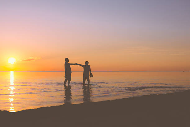 istock Senior couple walking at sunset 537368517