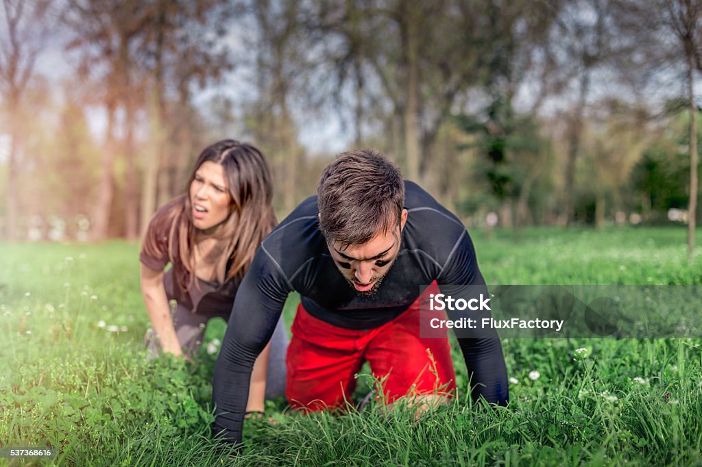 couple on their knees after running , exhausted sport couple on knees after exhausting running , race 20-29 Years Stock Photo