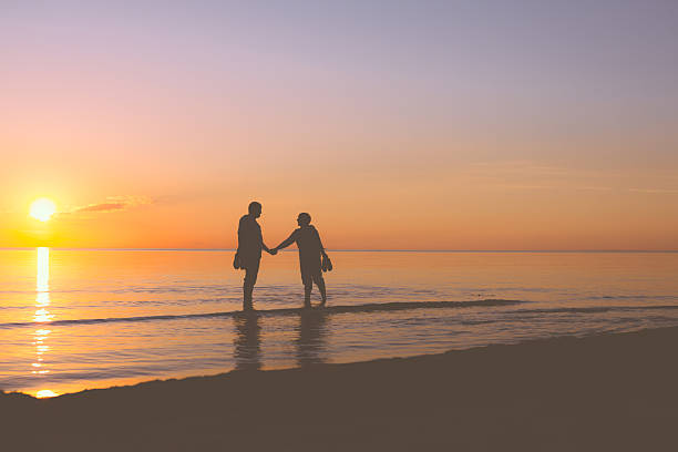 istock Senior couple strolling at sunset 537368617