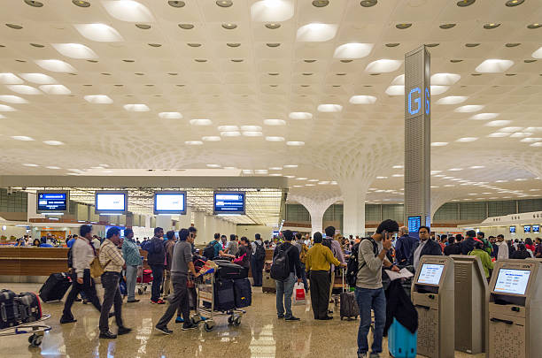 Passenger in Chhatrapati Shivaji International Airport. Mumbai, India - January 5, 2015: Passenger in Chhatrapati Shivaji International Airport. The New Terminal 2, International Departures on January 5, 2015 in Mumbai, India. Skidmore, Owings and Merrill (SOM) was the architectural designer of the project. india airport stock pictures, royalty-free photos & images