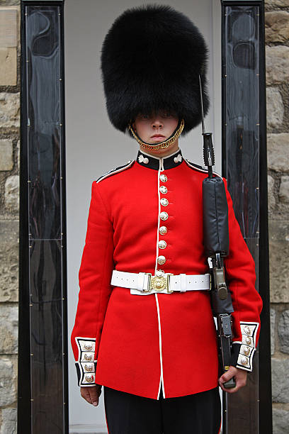 London's Queen Guard in Red Uniform Standing at His Post stock photo