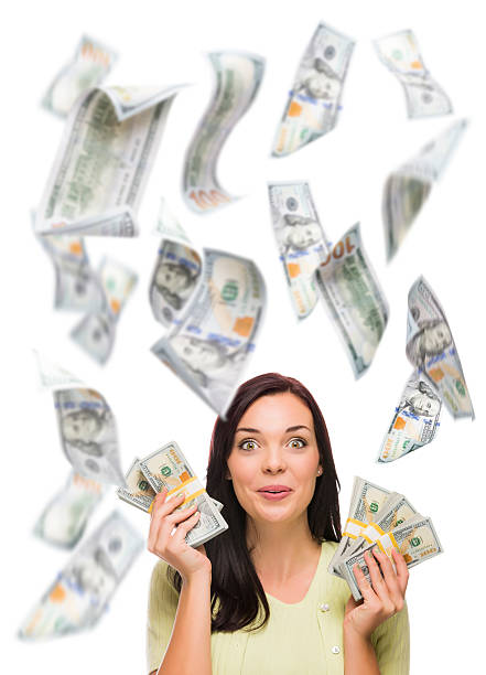 istock Happy Woman Holding the $100 Bills with Many Falling Around 537369265