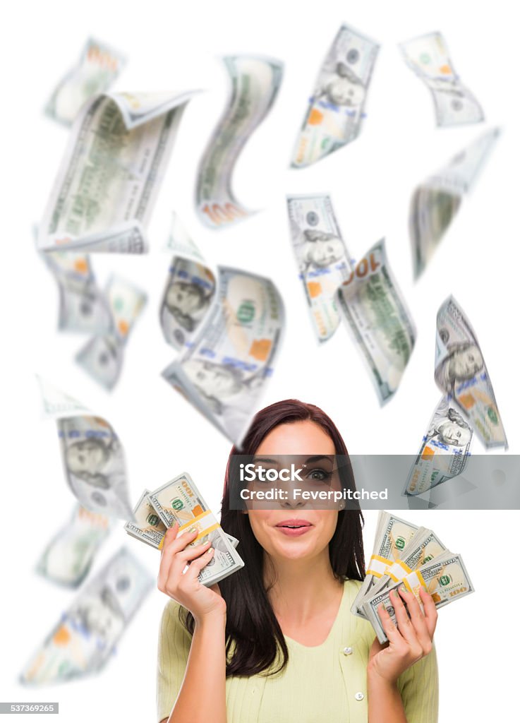 Happy Woman Holding the $100 Bills with Many Falling Around Celebrating Young Woman Holding $100 Bills with Many Others Falling Around Her on White. Mid-Air Stock Photo
