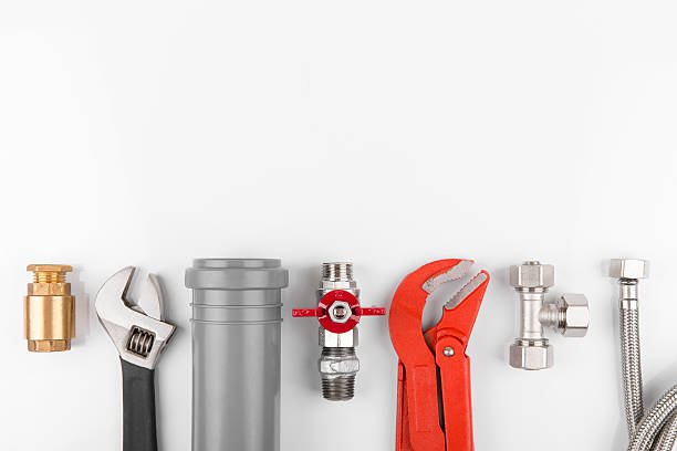 plumbing tools and equipment with copy space plumbing tools and equipment on white with copy space wrench photos stock pictures, royalty-free photos & images