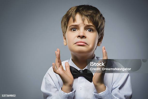 Closeup Portrait Of Handsome Boy With Astonished Expression While Standing Stock Photo - Download Image Now