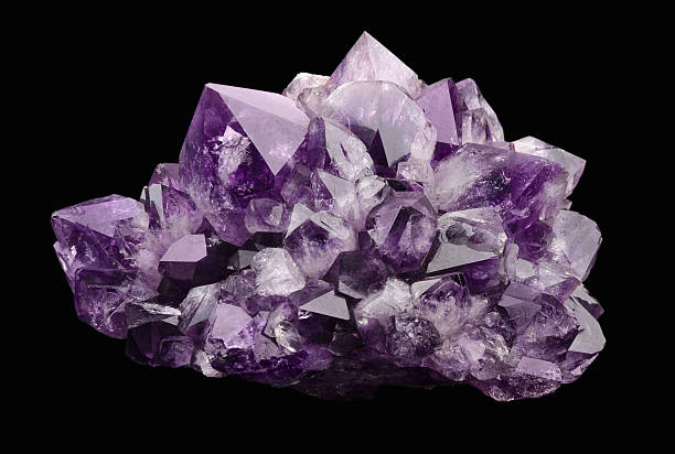 Amethyst over Black Background Amethyst over black background, a violet variety of quartz, often used in jewelry. Silica, silicon dioxide, SiO2. geode photos stock pictures, royalty-free photos & images