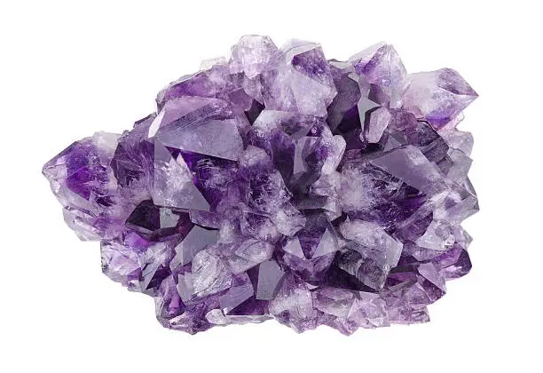 Amethyst directly above over white background, a violet variety of quartz, often used in jewelry. Silica, silicon dioxide, SiO2.