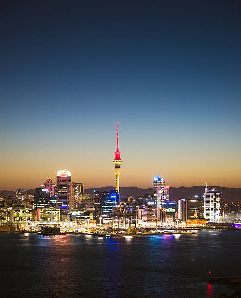 Auckland skyline at twilight Auckland's skyline at dusk, seen across the water of Waitemata Harbour, with the city's Sky Tower in the centre of the photograph. Waitemata Harbor stock pictures, royalty-free photos & images